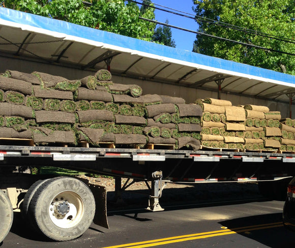 Grass delivery from a Semi Truck by Sod and Seed